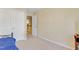 Empty bedroom features carpet, an open closet, and neutral-colored walls at 146 Skyros Loop, Cary, NC 27519