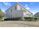 Neutral siding home with blue skies and green shrubbery at 146 Skyros Loop, Cary, NC 27519