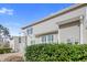 Home exterior showcases a covered patio and manicured bushes in the backyard at 146 Skyros Loop, Cary, NC 27519