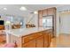 Spacious kitchen with a large island, stainless steel appliances, and ample cabinet space at 146 Skyros Loop, Cary, NC 27519