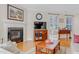 Comfortable living room featuring a fireplace, hardwood floors, and neutral decor for relaxation at 146 Skyros Loop, Cary, NC 27519