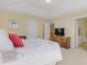 Main bedroom boasts ample natural light, neutral colors, and en suite bathroom access at 146 Skyros Loop, Cary, NC 27519
