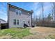 Well-maintained backyard features a patio and lawn at 15 Mcdowell Pkwy, Clayton, NC 27520