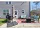Backyard patio with a grill, fire pit, and comfortable outdoor seating at 15 Mcdowell Pkwy, Clayton, NC 27520
