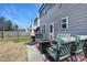 Backyard patio with a grill, fire pit, and comfortable outdoor seating at 15 Mcdowell Pkwy, Clayton, NC 27520