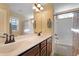 Bathroom with double sink vanity, bronze fixtures, a large mirror, and a shower with tub combination at 15 Mcdowell Pkwy, Clayton, NC 27520