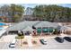 A beautiful community clubhouse with ample parking and green awning at 15 Mcdowell Pkwy, Clayton, NC 27520