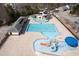 Aerial view of community pool featuring lap pool, water slides and splash area at 15 Mcdowell Pkwy, Clayton, NC 27520
