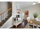 View of the dining area with a table, staircase, and a doorway leading to the front entrance at 15 Mcdowell Pkwy, Clayton, NC 27520
