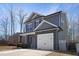 Charming two-story home with stone accents and attached two car garage at 15 Mcdowell Pkwy, Clayton, NC 27520