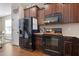 Well-equipped kitchen featuring stainless steel appliances, dark wood cabinets, and granite countertops at 15 Mcdowell Pkwy, Clayton, NC 27520
