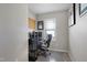 Functional office space featuring neutral tones, window blinds, and a comfortable black office chair at 15 Mcdowell Pkwy, Clayton, NC 27520