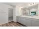 Bright bathroom features a double sink vanity with a large mirror and recessed lighting at 171 Piney Field Rd, Fuquay Varina, NC 27526