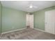 Inviting bedroom with a ceiling fan and view into a walk-in closet at 171 Piney Field Rd, Fuquay Varina, NC 27526