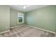 Comfortable bedroom with natural light, carpet floors and freshly painted walls at 171 Piney Field Rd, Fuquay Varina, NC 27526