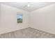 A well-lit bedroom with plush carpet and a window overlooking the outdoors at 171 Piney Field Rd, Fuquay Varina, NC 27526