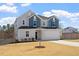 Charming two-story home with a two-car garage, well-manicured lawn and lovely curb appeal at 171 Piney Field Rd, Fuquay Varina, NC 27526