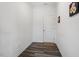 Hallway with gray, wood-look flooring and neutral walls provides a clean transition space at 171 Piney Field Rd, Fuquay Varina, NC 27526