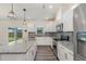 Bright kitchen with stainless appliances, granite counters and a sliding door at 171 Piney Field Rd, Fuquay Varina, NC 27526