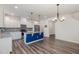 Modern kitchen featuring stainless appliances, granite countertops, blue island and pendant lighting at 171 Piney Field Rd, Fuquay Varina, NC 27526