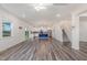 Bright and spacious living area opening to the kitchen with an island and staircase to second floor at 171 Piney Field Rd, Fuquay Varina, NC 27526