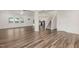 Open living room with hardwood flooring flowing into the kitchen and stairs at 171 Piney Field Rd, Fuquay Varina, NC 27526