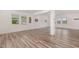 Open living room with hardwood flooring and plenty of natural light at 171 Piney Field Rd, Fuquay Varina, NC 27526