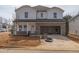 Two-story home featuring white siding, brick accents, and an attached two-car garage at 1720 Pie Filling Dr, Haw River, NC 27258