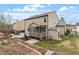 An angled view of the house with a large back deck, screen porch, and storage shed at 1720 Waddell Ct, Durham, NC 27703