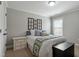 Cozy bedroom with a comfortable bed, stylish decor, and soft natural light at 1720 Waddell Ct, Durham, NC 27703