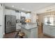 Bright kitchen with a center island, stainless steel appliances, and granite countertops at 1720 Waddell Ct, Durham, NC 27703