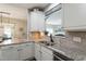 Well appointed kitchen with granite countertops, stainless appliances, and tiled backsplash at 1720 Waddell Ct, Durham, NC 27703