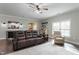 Spacious living area featuring a fireplace, hardwood floors, and natural light at 1720 Waddell Ct, Durham, NC 27703
