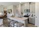 Modern kitchen with white countertops, stainless steel appliances, and a breakfast bar with seating at 1745 Pie Filling Dr, Haw River, NC 27258