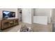 Basement living area with TV, wooden media console, and neutral carpeting at 186 Ethel Ln, Angier, NC 27501