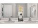Bright bathroom features a double vanity with modern fixtures and stylish decor at 186 Ethel Ln, Angier, NC 27501