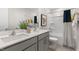 Bathroom with double sink vanity, modern fixtures, and a shower-tub combination at 186 Ethel Ln, Angier, NC 27501