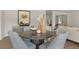 Dining area with gray upholstered chairs surrounding a round wooden table at 186 Ethel Ln, Angier, NC 27501