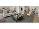 Inviting living room featuring a sofa, accent chairs, area rug, and views into other areas at 186 Ethel Ln, Angier, NC 27501