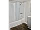 Bathroom featuring a shower with blue patterned curtain, gray walls, gray vanity and wood floors at 1960 Brogden Rd, Smithfield, NC 27577