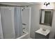 Bathroom featuring a shower with blue patterned curtain, gray walls, and gray vanity at 1960 Brogden Rd, Smithfield, NC 27577