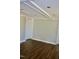 Bedroom with white walls, wood-look flooring, trim and door at 1960 Brogden Rd, Smithfield, NC 27577