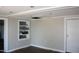 Well-lit room featuring built-in shelving and modern flooring, perfect for a home office or guest room at 1960 Brogden Rd, Smithfield, NC 27577
