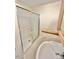 Bathroom showcasing a glass-enclosed shower and white pedestal sink at 2001 S Ashland Dr, Burlington, NC 27217