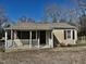 Charming single story home featuring vinyl siding and a covered front porch with white railings at 2001 S Ashland Dr, Burlington, NC 27217