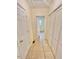 Hallway featuring vinyl flooring, leading to rooms bathed in natural light at 2001 S Ashland Dr, Burlington, NC 27217