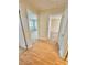 Hallway featuring vinyl flooring, leading to rooms bathed in natural light at 2001 S Ashland Dr, Burlington, NC 27217