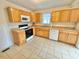 Kitchen featuring wood cabinets and stainless steel appliances at 2001 S Ashland Dr, Burlington, NC 27217