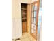 Pantry featuring wood shelves and a door at 2001 S Ashland Dr, Burlington, NC 27217