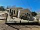 Spacious wooden deck with wire railing and furniture overlooking the backyard at 2001 S Ashland Dr, Burlington, NC 27217